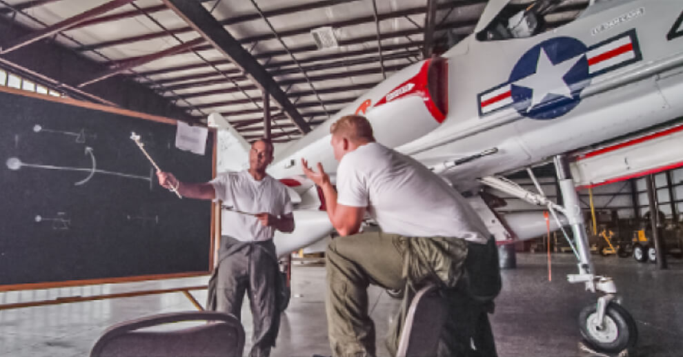 Two men in conversation and mentoring session